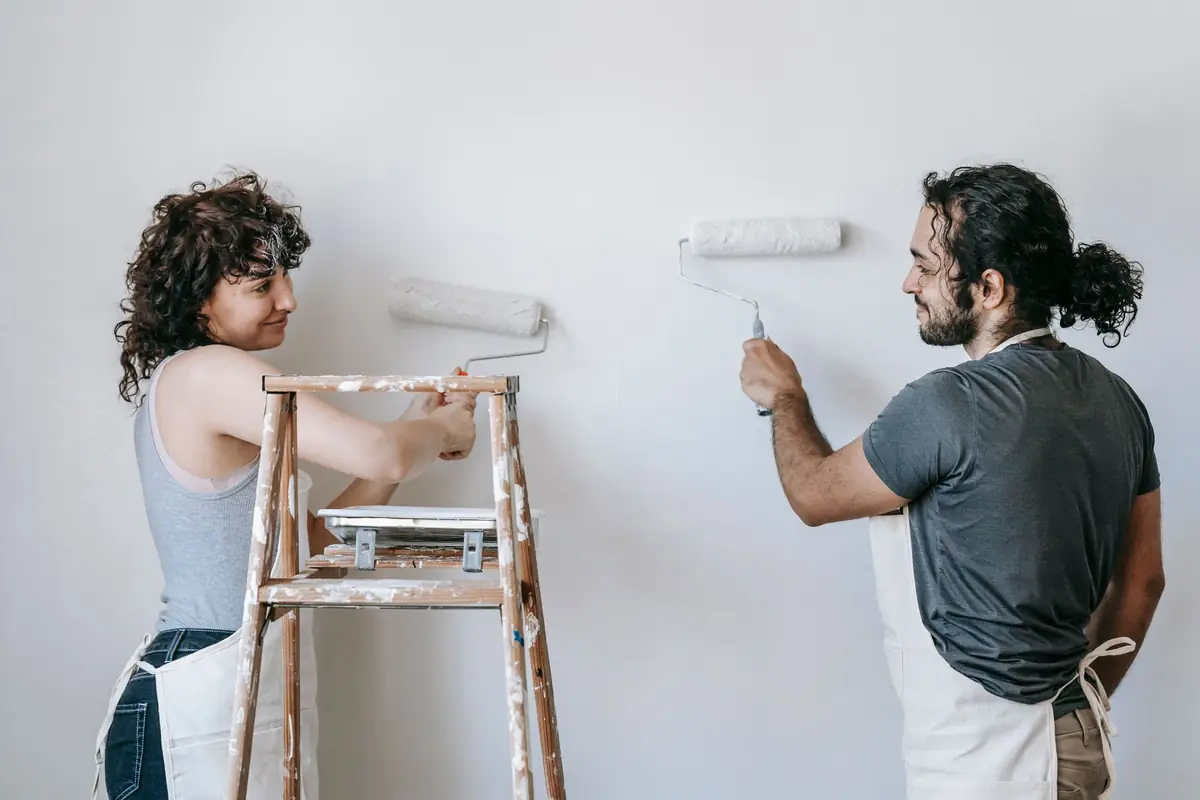 People painting a wall together — painting help in Worcester