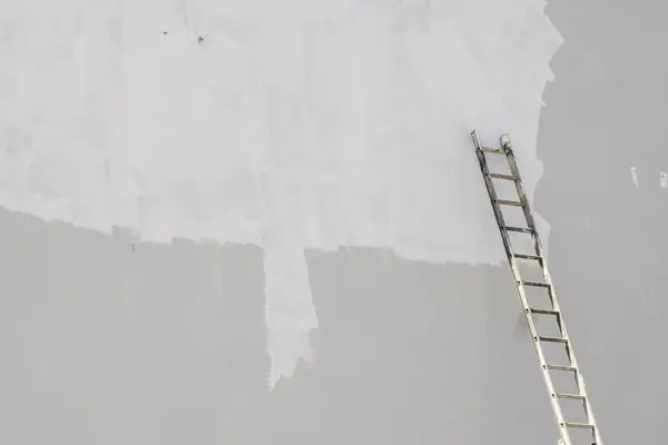 Exterior painting in Worcester: ladder against a freshly primed wall